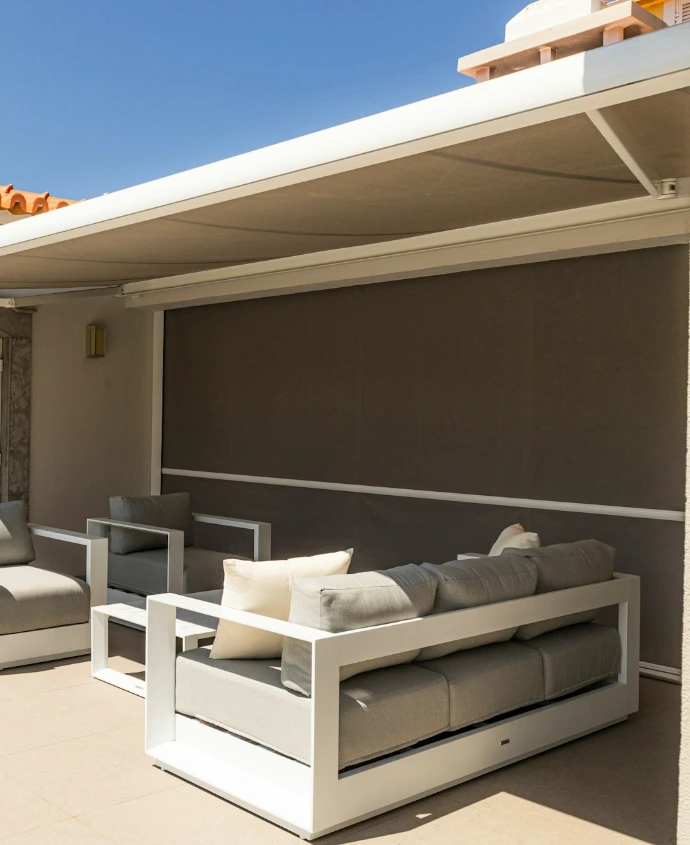 Outdoor patio with stylish seating and awning